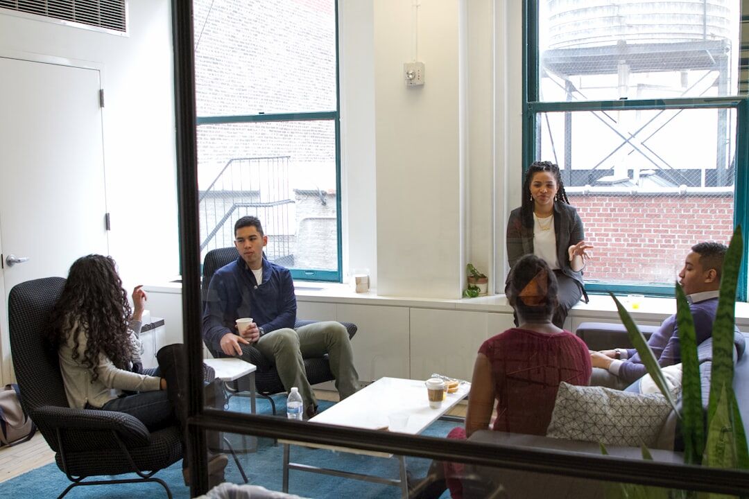 Diverse media production team meeting in office