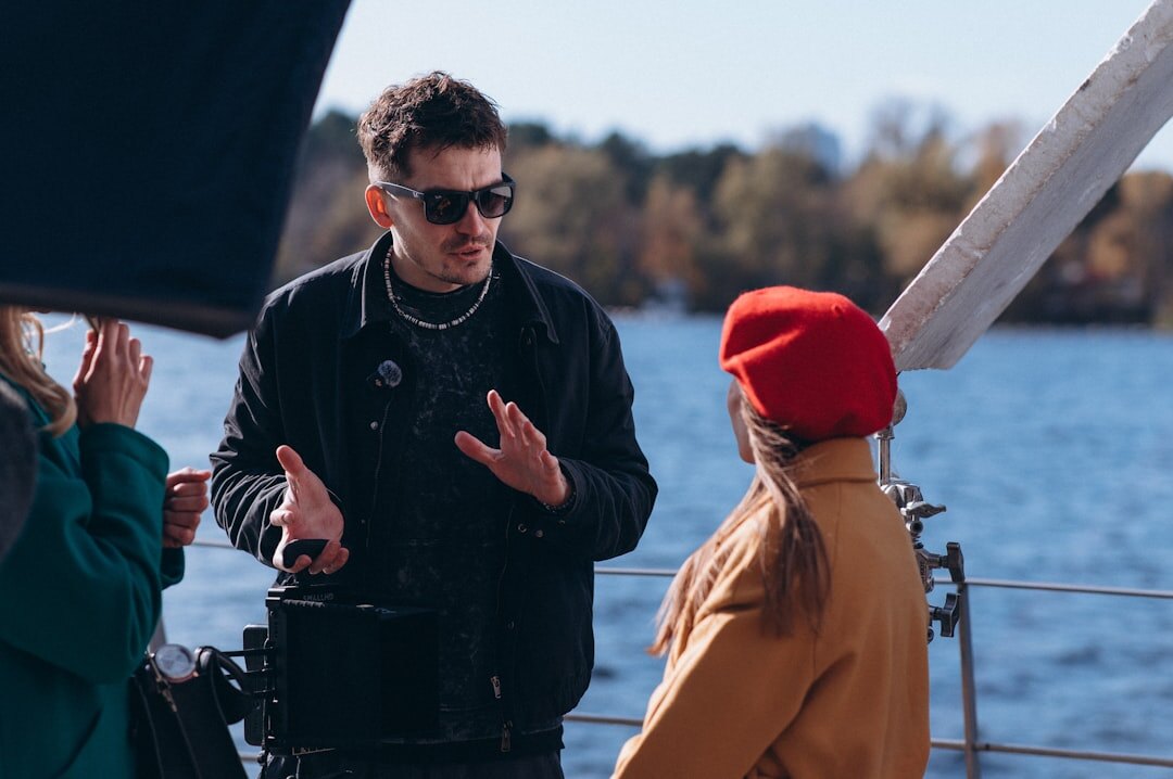 Camera operator filming outdoors on location